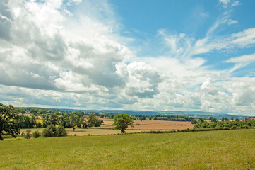 Fototapeta na wymiar Clouds across the summertime landscape in England,