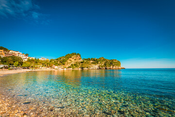 Turquoise water on the beach of Taormina, Sicily 