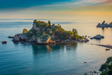 Warm sunset light at Isola Bella Nature Reserve in Taormina, Sicily 