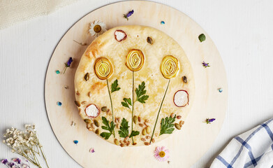 cake with a picture of flowers on a wooden base on a light background top view
