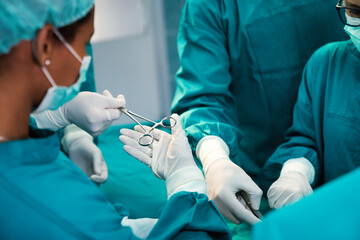 Group of surgeon team at work in operating room in hospital
