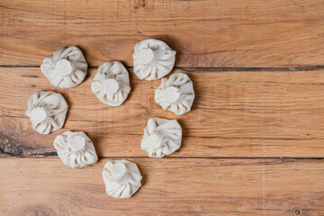 Khinkali in shape of a heart on a wooden table. Valentines Day concept, love for food.