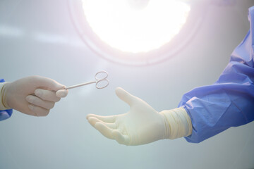 Surgeon and physician assistant team The instruments are being prepared for surgery in a hospital operating room.