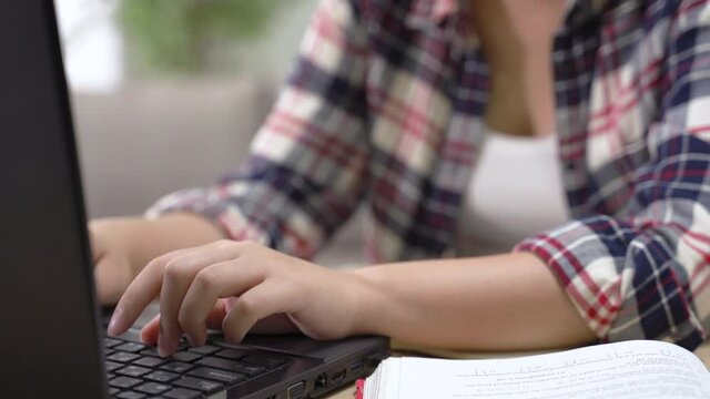 hands typing on computer keyboard