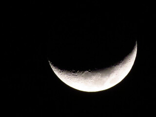 Beautiful shot of the half-moon in the dark space