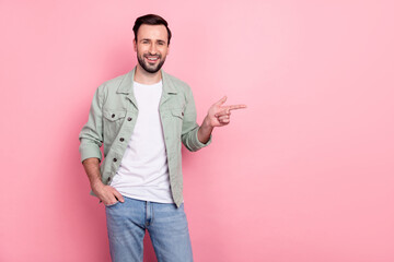 Portrait of attractive cheerful guy demonstrating copy empty space ad look select isolated over...