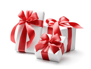 White gift boxes with red bows isolated on white background - clipping path included