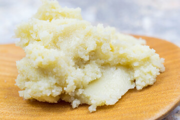 Shea butter on light background, unrefined, close up