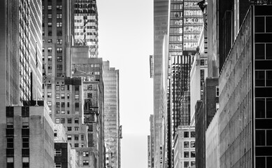 NYC buildings structure. Street view in Midtown Manhattan.  Close up New York architecture. Black...