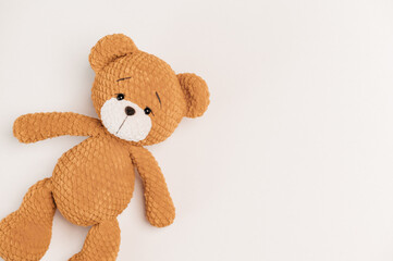 knitted toy bear on a white background