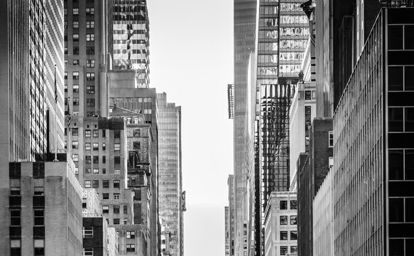 NYC buildings structure. Street view in Midtown Manhattan.  Close up New York architecture. Black and white wallpaper photo.