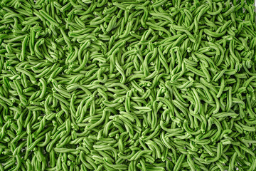 Fresh green casarecce pasta with spinach close-up. Dry pasta texture
