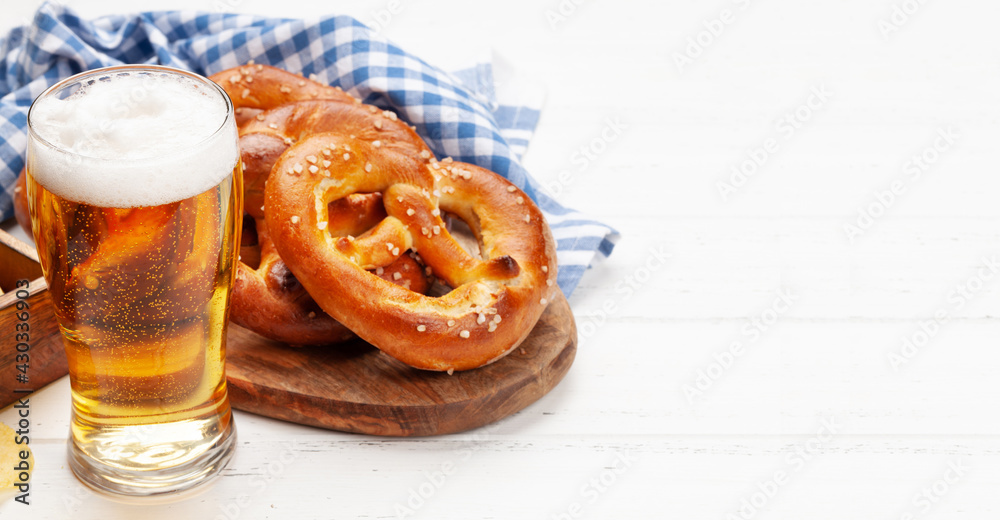 Wall mural Lager beer mug and fresh baked homemade pretzel