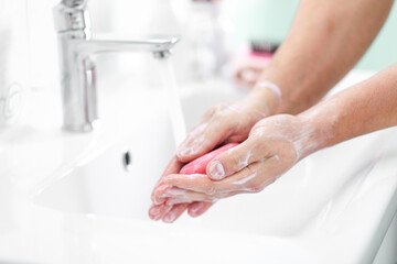 Fototapeta na wymiar thorough hand washing with soap and water to prevent coronavirus - Image