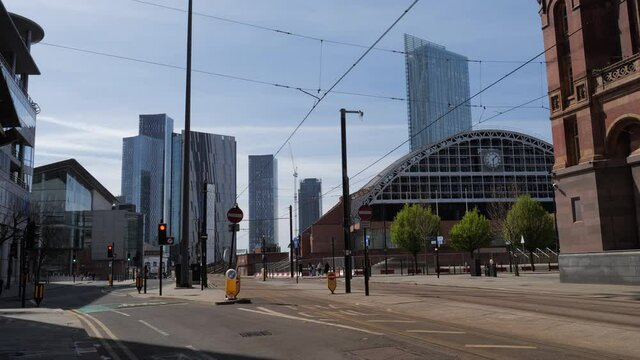 4K: Manchester City , England, UK. Metro Trams pass by Convention centre with Skyscrapers behind. Stock Video Clip Footage