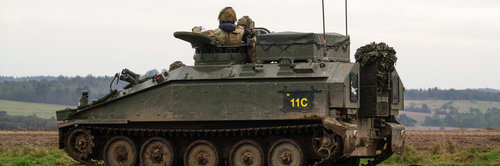 british army FV103 Spartan light infantry fighting vehicle tank on maneuvers on Salisbury Plain, Wiltshire