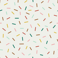Seamless vector pattern with decorative sprinkles. Colourful donut glaze or ice cream top festal background. Celebrating Christmas party dash confetti backdrop.