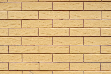 Texture of brick wall. Samples of wall or fence are presented at exhibitions. Yellow brick close up.