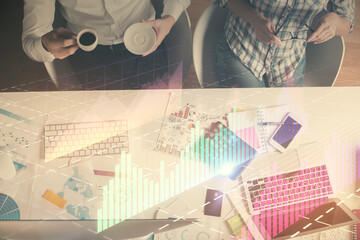 Double exposure of man and woman working together and financial chart hologram drawing. market analysis concept. Computer background. Top View.