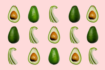 avocado whole and in section, tender pink background with avacado flat view