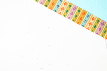 和紙と和柄リボンの背景（水色と白）（模様の名前：うんげん）