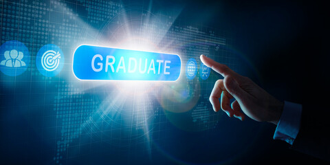 A businessmans hand selecting a Graduate business word concept on a computer display.