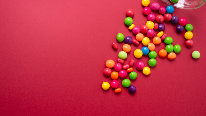 colorful little candies on a colored background