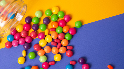 Obraz premium colorful little candies on a colored background