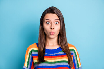 Photo portrait of shocked woman whistling in striped outfit staring isolated on vibrant blue color...