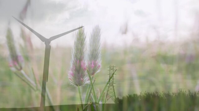 Animation of wind turbine spinning over flowers in spring meadow