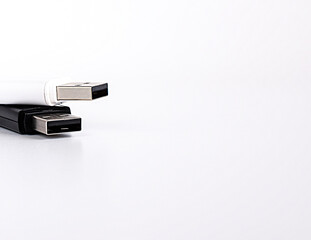 Two USB drives on a light background. Copy space.