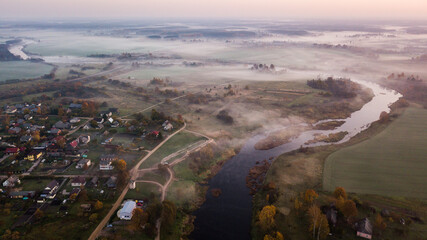 Aerial view of the Venta river bends in the autumn morning mist, Latvia