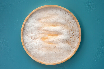 Top view above closeup white soap water bubbles mockup for organic gentle facial skincare product...