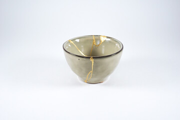Beige kintsugi bowl with gold scars