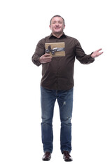 Naklejka premium in full growth. happy man with a gift box.