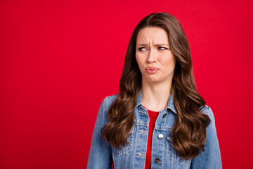 Portrait of attractive sad wavy-haired girl looking aside bad smell copy space isolated over...