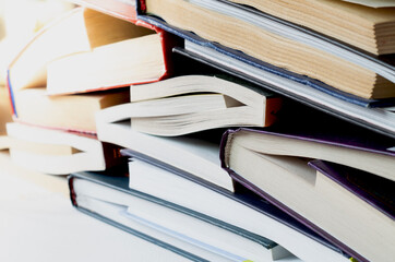 A stack of old books on a white background.