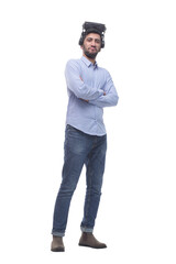 Naklejka premium in full growth. confident young man in virtual reality glasses.