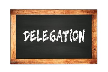 DELEGATION text written on wooden frame school blackboard.