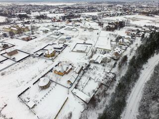 Aerial view of the countryside with the snow at winter time (drone image). Saburb of Kiev,Ukraine