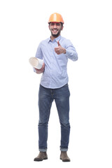 young man with drawings pointing at a white screen.