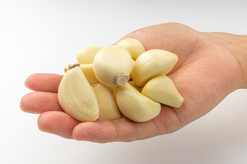Manicured garlic on white background