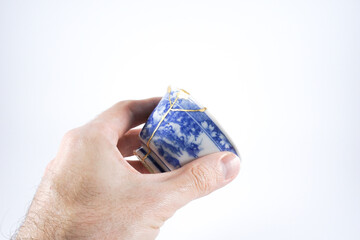 Japanese blue and white decorated sake cup, kintsugi pottery with real gold