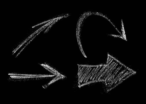 Set Of Arrows Drawn In Chalk. Isolate on A Black Background. Hand-drawn design element.