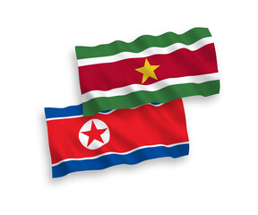 Flags of North Korea and Republic of Suriname on a white background
