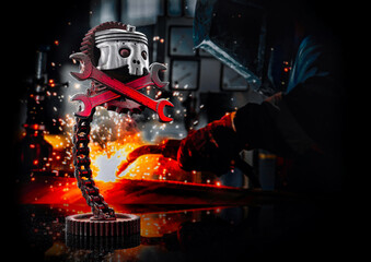 a welder in a factory makes a metal sculpture