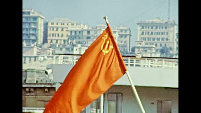 Russian cruise ship with the flag of the Soviet Union in the city port of Genova town in 1981. Archival of Italy in the 1980s with Genova city Italian harbor.
