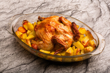 Grilled chicken with baked potato on table