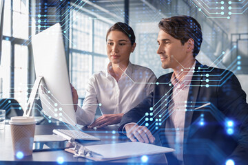 Businessman and businesswoman in formal wear working together to optimize business process by applying new technologies. Hi tech holograms over modern office background with panoramic windows