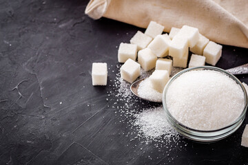 sugar refined on a dark stone background